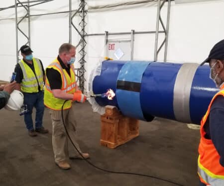 Applying heat shrink sleeve to 36-inch diameter steel pipe joint